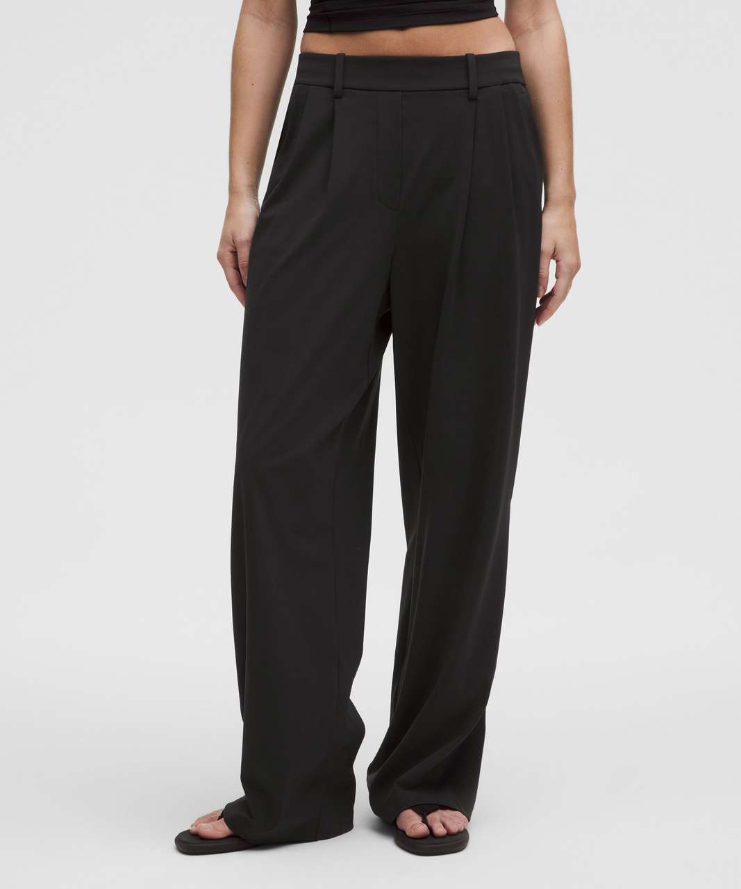 Person wearing black wide-leg pants on a white background. Lululemon. Sherwood Park consignment, Sherwood Park shopping, consignment store Sherwood Park, Edmonton consignment, secondhand shopping, secondhand clothing, women’s consignment, women’s clothing consignment, curated consignment, quality secondhand clothing, pre-loved clothing, thrift shopping, sustainable fashion, local shopping, Alberta consignment