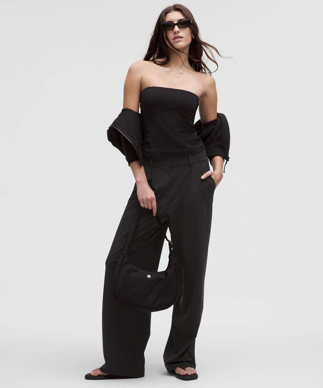 Woman wearing a black outfit with wide-leg pants on a white background. Lululemon. Sherwood Park consignment, Sherwood Park shopping, consignment store Sherwood Park, Edmonton consignment, secondhand shopping, secondhand clothing, women’s consignment, women’s clothing consignment, curated consignment, quality secondhand clothing, pre-loved clothing, thrift shopping, sustainable fashion, local shopping, Alberta consignment