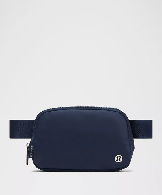 Lululemon Belt Bag, secondhand, preloved, Navy blue waist bag with a visible brand logo on a light gray background
